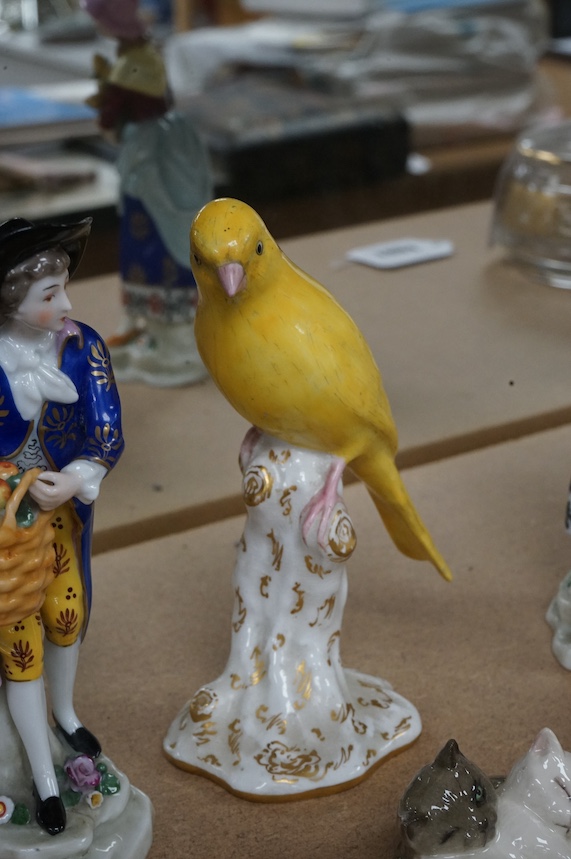 A small group of mixed ceramics to include a Royal Worcester model of a canary, No 2665, a Royal Doulton ‘cat’ group and a pair of continental figures. Tallest 16cm. Condition - mostly good